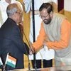 President Pranab Mukherjee greets Prakash Javadekar after administering oath to him as a Cabinet minister during a swearing-in ceremony at Rashtrapati Bhavan in New Delhi.