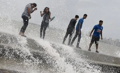 Monsoon rains 35% above average last week: IMD People enjoying a high tide at Marine Drive promenade in Mumbai