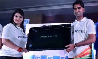 Paid a big price to deliver world's cheapest phone, claims Ringing Bells Director of Ringing Bells, Mohit Goel with CEO, Dhaarna Goel during the launch of Freedom LCD TV- 9990 in New Delhi