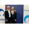 Emmanuel Faber (L), Chief Executive Officer of Danone, and Gregg Engles, Chairman and Chief Executive Officer of WhiteWave Foods Company, pose before the start of a news conference in Paris