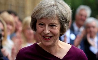 British PM May says discussed Brexit with Obama Britain's Home Secretary, Theresa May, makes a statement outside the Palace of Westminster in London after she won 199 votes for the Conservative leadership.