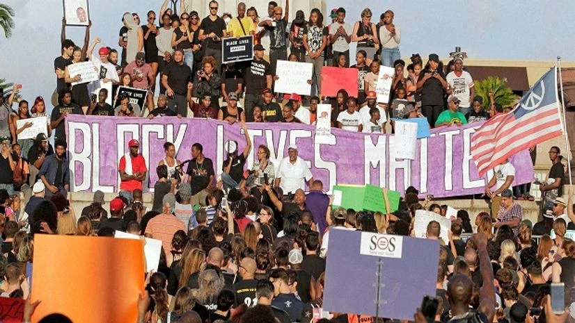 Black Lives Matter, Protest People gather for a rally in protest of the shootings of African-American men by police in Minnesota and in Baton Rouge, La., at Lee Circle in New Orleans on Friday Photo: PTI