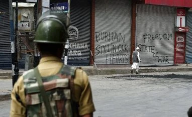 Kashmir would have 'burned' if not for PM Modi: Shiv Sena A CRPF man guards during restriction and strike in Srinagar. Photo: PTI