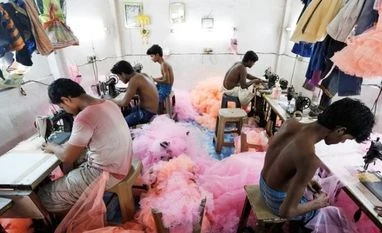 Covid-19 to shave off over a third of apparel retailers' revenues Employees work inside a garment factory in Mumbai (Pic: Reuters)