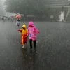 Children enjoy monsoon rains