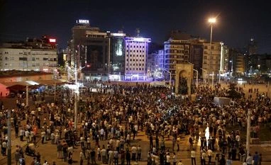 Erdogan urges Turks to defend state after coup 'foiled' Supporters of Turkey's President Recep Tayyip Erdogan, gather in Istanbul's Taksim square, early morning