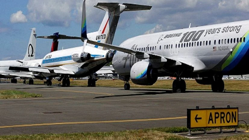 Boeing 7-series passenger airplanes, including an Alaska Airlines 737 with a special livery marking the 100th Anniversary of Boeing, sit parked in a lineup formation in Seattle. Boeing 7-series passenger airplanes, including an Alaska Airlines 737 with a special livery marking the 100th Anniversary of Boeing, sit parked in a lineup formation in Seattle.