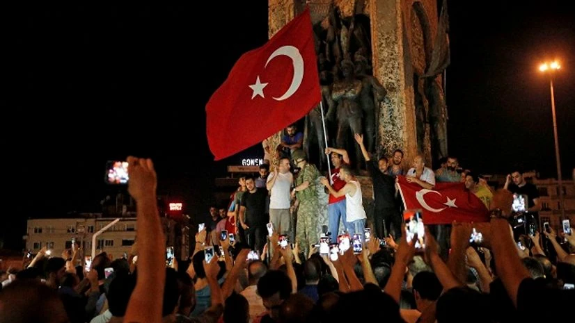 Supporters of Turkey's President Recep Tayyip Erdogan, gather, waving Turkish flags, in Istanbul's Taksim square. Supporters of Turkey's President Recep Tayyip Erdogan, gather, waving Turkish flags, in Istanbul's Taksim square.