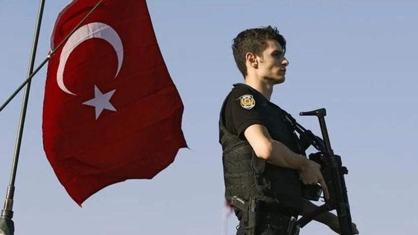 A policeman stands atop of a military armored vehicle after troops involved in the coup surrendered on the Bosphorus Bridge in Istanbul A policeman stands atop of a military armored vehicle after troops involved in the coup surrendered on the Bosphorus Bridge in Istanbul