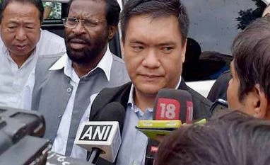 Will follow my father's footsteps, work for development of Arunachal Pradesh: Pema Khandu Designated Arunachal Pradesh Chief Minister Pema Khandu talking to reporters at Raj Bhawan after staking claim to form the Congress government in the state in Itanagar