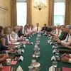 Britain's Prime Minister Theresa May, left side at center, holds her first cabinet meeting at Downing Street in London
