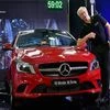 MD &amp; CEO of Mercedes Benz India, Roland Folger with a mercedes car during the launch of the "My Mercedes-My Service" programme at a press conference in Bengaluru.