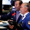 Traders work on the floor of the New York Stock Exchange (NYSE) shortly after the opening bell in New York