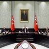 Turkey's President Recep Tayyip Erdogan, centre, heads an emergency meeting of the National Security Council with Prime Minister Binali Yildirim, center left, Chief of Staff Gen. Hulusi Akar, center right, and ministers in Ankara, Turkey, Wednesday
