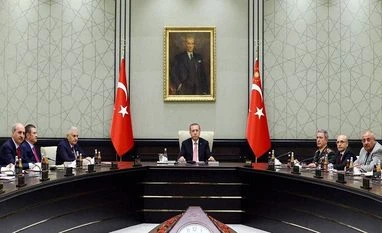 Other countries might be involved in coup attempt: Erdogan Turkey's President Recep Tayyip Erdogan, centre, heads an emergency meeting of the National Security Council with Prime Minister Binali Yildirim, center left, Chief of Staff Gen. Hulusi Akar, center right, and ministers in Ankara, Turkey, Wednesday