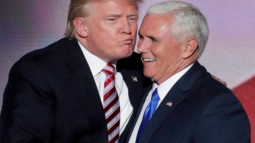 Republican Presidential Candidate Donald Trump, give his running mate Republican Vice Presidential Nominee Gov. Mike Pence of Indiana a kiss after Pence's acceptance speech during the third day of the Republican National Convention in Cleveland Photo Republican Presidential Candidate Donald Trump, give his running mate Republican Vice Presidential Nominee Gov. Mike Pence of Indiana a kiss after Pence's acceptance speech during the third day of the Republican National Convention in Cleveland Photo