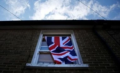 Bankers expect Britain to back Brexit transition calls A British flag flutters in front of a window in London