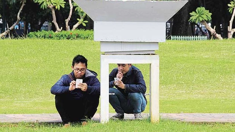 People play Pokemon GO in a park in Central Jakarta, Indonesia People play Pokemon GO in a park in Central Jakarta, Indonesia