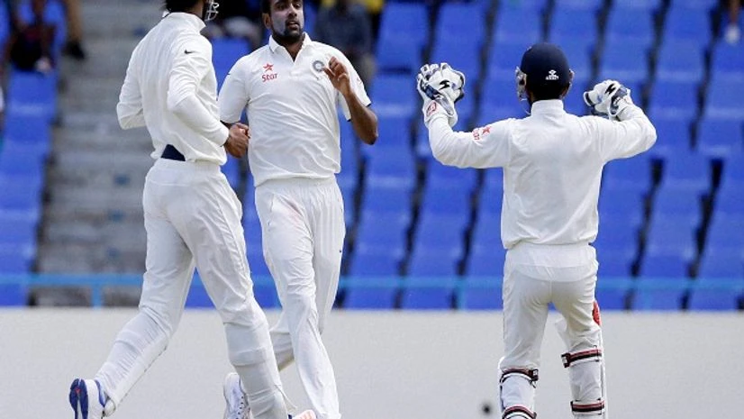 India's bowler Ravichandran Ashwin centre celebrates with teammates after he bowled out West Indies' Marlon Samuels during day four of their 1st cricket Test match at the Sir Vivian Richards Stadium in North Sound, Antigua. India's bowler Ravichandran Ashwin centre celebrates with teammates after he bowled out West Indies' Marlon Samuels during day four of their 1st cricket Test match at the Sir Vivian Richards Stadium in North Sound, Antigua.
