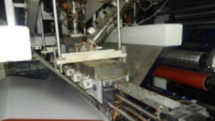 T-die section of Uflex Ltd's extrusion lamination machine EL-1300 T-die section of Uflex Ltd's extrusion lamination machine EL-1300