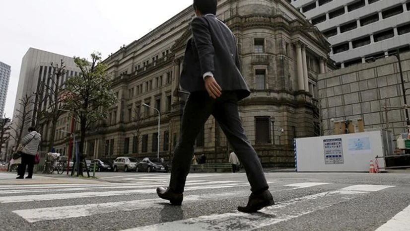 A businessman walks past the Bank of Japan (BOJ) building in Tokyo, Japan. Photo: Reuters A businessman walks past the Bank of Japan (BOJ) building in Tokyo, Japan. Photo: Reuters
