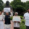 YSR Congress Party members holding a protest to demand special status for Andhra Pradesh at Parliament House during the ongoing monsoon session in New Delhi