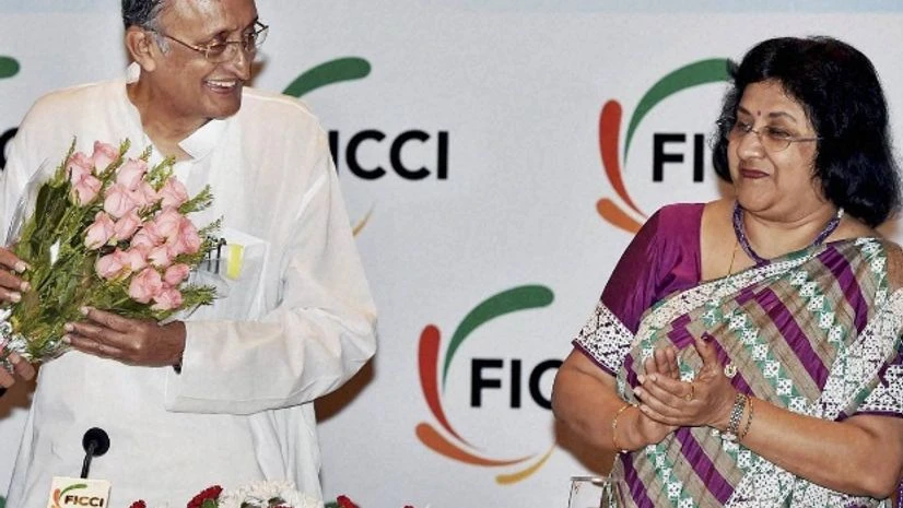 West Bengal Finance Minister Amit Mitra receives a bouquet from Chairman, FICCI's West Bengal State Council, Gaurav Swarup as Chairperson, State Bank of India, Arundhati Bhattacharya looks on during 13th Banking Conclave in Kolkata West Bengal Finance Minister Amit Mitra receives a bouquet from Chairman, FICCI's West Bengal State Council, Gaurav Swarup as Chairperson, State Bank of India, Arundhati Bhattacharya looks on during 13th Banking Conclave in Kolkata