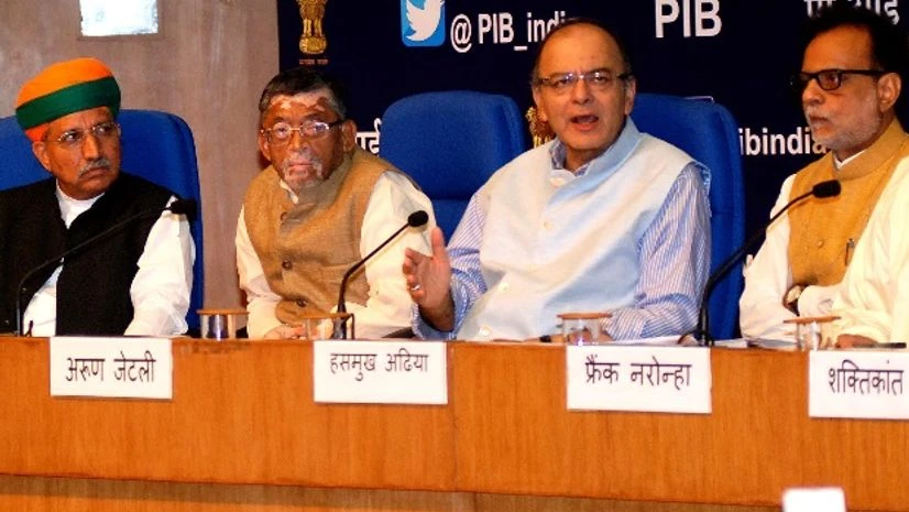 Union Finance Minister, Arun Jaitley with Ministers of State for Finance, Santosh Kumar Gangwar and Revenue Secretary Hasmukh Adhia at a Press Conference on the Goods and Services Tax (GST) in New Delhi Union Finance Minister, Arun Jaitley with Ministers of State for Finance, Santosh Kumar Gangwar and Revenue Secretary Hasmukh Adhia at a Press Conference on the Goods and Services Tax (GST) in New Delhi