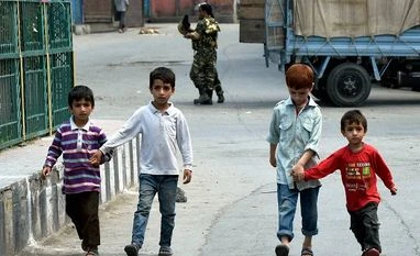 Kashmir is our problem, stop blaming Pak: Mani Shankar Aiyar Children walking on a street during 28th day of curfew in Srinagar on Friday Photo: PTI