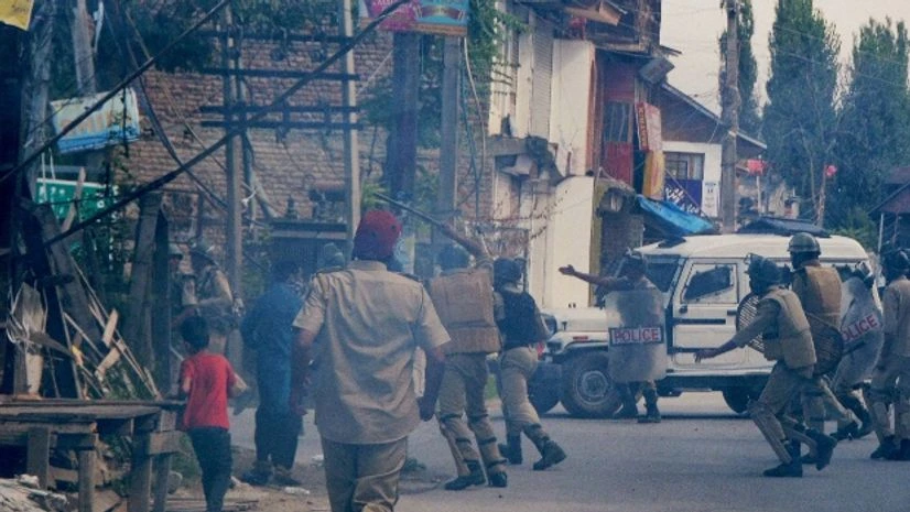 Police in action against the protesters who defied curfew and tried to march to Hazratbal Shrine at Nati Pora in Srinagar Police in action against the protesters who defied curfew and tried to march to Hazratbal Shrine at Nati Pora in Srinagar
