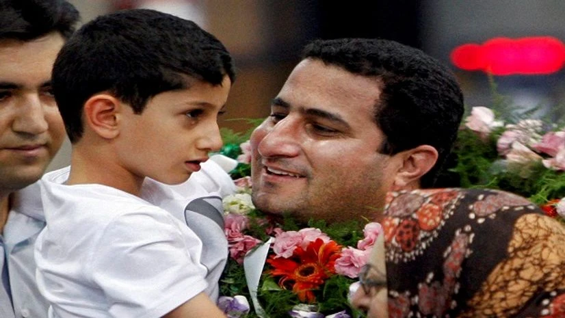Iran, Shahram Amiri, Execuion In this July 15, 2010 file photo, Shahram Amiri, an Iranian nuclear scientist greets his son Amir Hossein as he arrives to the Imam Khomeini airport after returning from the United States, outside Tehran Photo: PTI