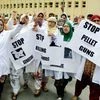 Nurses and paramedics hold placards and shout slogans during a protest rally against the killing of 55 civilians and use of pellet guns by forces, outside SMHS Hospital in Srinagar