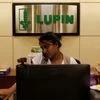 An employee of Lupin Limited works at a reception at their headquarters in Mumbai