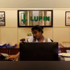 An employee of Lupin Limited works at a reception at their headquarters in Mumbai An employee of Lupin Limited works at a reception at their headquarters in Mumbai