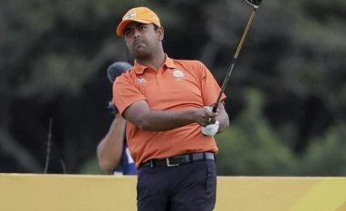 Topsy-turvy day for India on day 1 of Olympic golf Anirban Lahiri of India watches his tee shot on the 3rd hold during the first round of the men's golf event