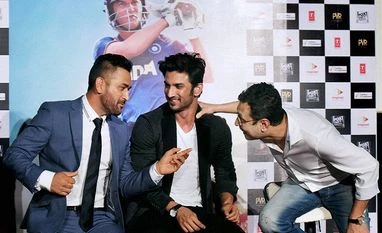 MS Dhoni - The Untold Story crosses Rs 100 crore at box office Ace Cricketer M S Dhoni and Bollywood actor Sushant Singh along with Director Neeraj Pandey during the trailer launch of the movie 'MS Dhoni - The Untold Story' in Mumbai.