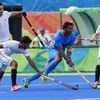 India's and Canadian player in action during a men's field hockey match at Summer Olympics 2016 in Rio de Janeiro, Brazil