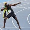 Rio de Janeiro: Jamica's Usain Bolt strikes his signature pose after winning the gold in Men's 100m in the 2016 Summer Olympics at Rio de Janeiro in Brazil on Sunday night . PTI Photo by Atul Yadav(PTI8_15_2016_000071A)
