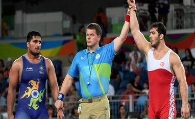 Hardeep Singh loses his Greco Roman bout; waits for repechage result Ildem Cenk of Turkey is declared winner against India's Hardeep Singh (Blue) in Men's 98 Kg wrestling