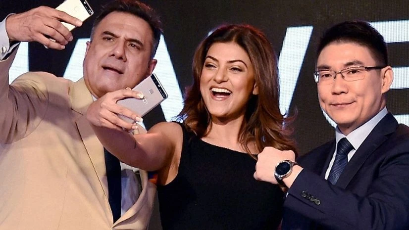 Bollywood actors Sushmita Sen and Boman Irani along with a Huawei official during launch of Huawei P9 smartphone in New Delhi Bollywood actors Sushmita Sen and Boman Irani along with a Huawei official during launch of Huawei P9 smartphone in New Delhi