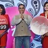 Air Asia India CEO Amar Abrol with Airlines hostesses during a press conference to announce the fleet and route expansion plans in Bengaluru
