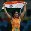 Indian wrestler celebrates after winning a bronze medal at the Rio Olympics