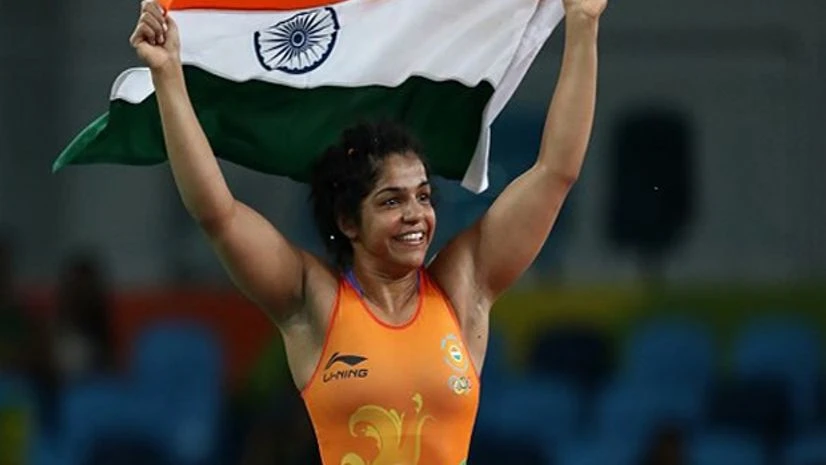 Indian wrestler celebrates after winning a bronze medal at the Rio Olympics Indian wrestler celebrates after winning a bronze medal at the Rio Olympics