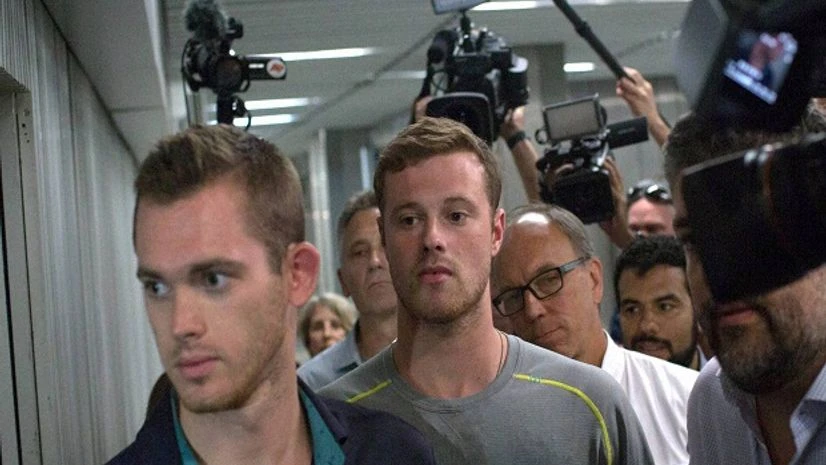 Olympic swimmers Gunnar Bentz, left, and Jack Conger, center, Olympic swimmers Gunnar Bentz, left, and Jack Conger, center,