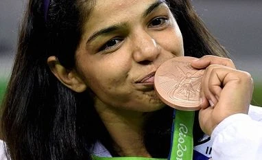Sakshi Malik to be awarded Rs 2.5 cr by Haryana government India's Sakshi Malik poses with her bronze medal for the women's wrestling freestyle 58-kg competition during the medals ceremony