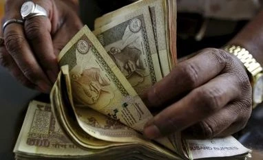 Lok Sabha passes Bill to make holding of old notes punishable Indian rupee currency notes