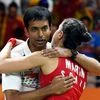 Spain's Carolina Marin with Indian coach Pullela Gopichand  after defeating India's V. Sindhu Pusarla in the women's badminton singles gold medal match at the Rio Olympics