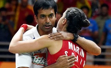 Rio Olympics: Pullela Gopichand downplays PV Sindhu's loss in the finals Spain's Carolina Marin with Indian coach Pullela Gopichand after defeating India's V. Sindhu Pusarla in the women's badminton singles gold medal match at the Rio Olympics