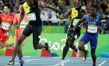 Rio Olympics: Usain Bolt bids adieu Jamaica's Nickel Ashmeade, second right, passes the baton to Usain Bolt in the men's 4 x 100-meter relay final
