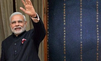 Rahul Gandhi takes a dig at PM Modi over his suit File Photo - Prime Minister Narendra Modi wearing a suit with his name woven into it in gold pinstripes